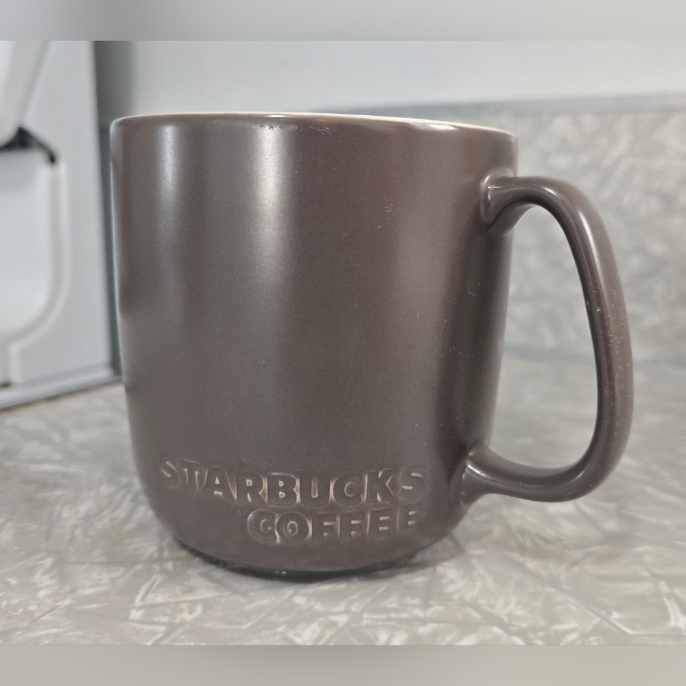 STARBUCKS 2010 Solid Brown Embossed Bone China Mug